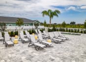 Thumbnail 33 of 59 - the pool area at the preserve at ballantyne commons with chaise lounge chairs