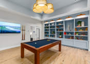 Thumbnail 29 of 59 - a games room with a pool table and a tv