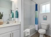 Thumbnail 20 of 59 - two views of a bathroom with a toilet sink and tub