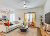 Thumbnail 6 of 59 - a living room with a couch and a coffee table