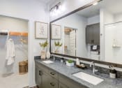 Thumbnail 19 of 24 - a bathroom with two sinks and a large mirror