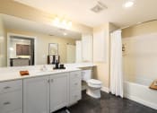 Thumbnail 29 of 32 - a bathroom with a sink toilet and a shower