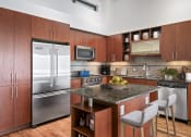 Thumbnail 3 of 51 - Kitchen with stainless steel appliances and a marble counter top at Equinox, Seattle, WA