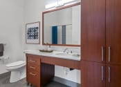 Thumbnail 7 of 51 - Bathroom with a sink and a mirror and a toilet