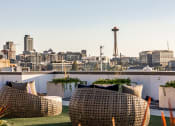 Thumbnail 23 of 51 - Equinox Rooftop Terrence view of Space Needle  at Equinox Apartments, Seattle, Washington