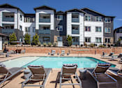 Thumbnail 6 of 23 - Pool deck with lounge chairs