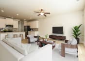 Thumbnail 15 of 60 - a living room filled with furniture and a flat screen tv