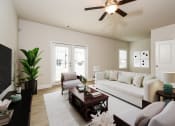 Thumbnail 19 of 60 - a living room with a white couch and a brown coffee table