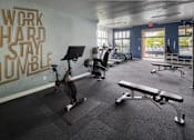 Thumbnail 14 of 23 - A gym with a wall that says