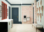 Thumbnail 18 of 26 - A room with a blue door and a bench.