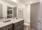 Thumbnail 19 of 29 - a bathroom with a sink and a toilet
