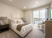Thumbnail 9 of 29 - a master bedroom with a large bed and a window