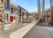 Thumbnail 17 of 23 - our apartments have a courtyard with tables and chairs and a red door