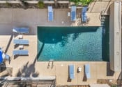 Thumbnail 21 of 23 - a birds eye view of a swimming pool in the middle of a building with blue