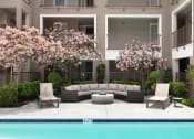 Thumbnail 14 of 17 - a patio with a couch and two chairs next to a pool