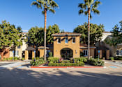 Thumbnail 17 of 24 - A building with the number 1160 on it is surrounded by palm trees.