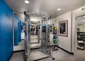 Thumbnail 21 of 27 - Workout room with weights and mirrors in a home gym at Ascend2300, CA, 92008