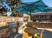 Thumbnail 25 of 27 - Patio with a table and chairs and an umbrella at Ascend2300, Carlsbad, CA, 92008