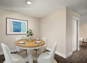 Thumbnail 8 of 22 - A dining room with a round table and white chairs.