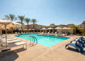 Thumbnail 3 of 47 - a swimming pool with lounge chairs and umbrellas at the resort