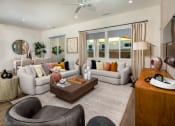 Thumbnail 22 of 47 - a living room with couches and a coffee table