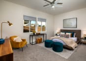 Thumbnail 27 of 47 - a bedroom with a bed and a ceiling fan
