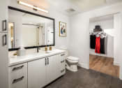 Thumbnail 16 of 48 - a bathroom with white cabinets and a large mirror at VORA LUX, San Diego, 92120