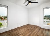 Thumbnail 46 of 48 - an empty room with two windows and a ceiling fan at VORA LUX, San Diego
