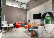 Thumbnail 40 of 48 - a living room filled with furniture and a flat screen tv at VORA LUX, San Diego, CA 92120