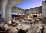 Thumbnail 24 of 48 - a living room filled with furniture and a fire pit at VORA LUX, San Diego, 92120
