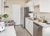 Thumbnail 7 of 33 - Kitchen space with stainless steel appliances at Canyon Park Apartments, Beaverton, OR 97005