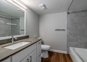 Thumbnail 10 of 19 - a bathroom with a sink toilet and a shower