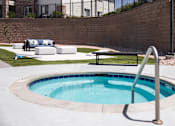 Thumbnail 21 of 37 - A small round pool with a metal ladder.