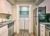 Thumbnail 34 of 35 - Kitchen and laundry room