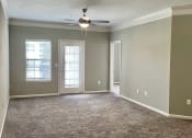 Thumbnail 38 of 44 - spacious living room with patio access