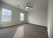 Thumbnail 40 of 44 - bedroom with ceiling fan and carpet