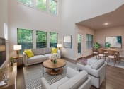 Thumbnail 2 of 31 - a living room with couches and chairs and a table