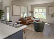 Thumbnail 7 of 34 - A modern living room with a brown leather couch and a grey armchair.