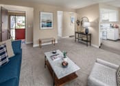 Thumbnail 6 of 29 - Living room with a couch and a table at Summerfield, Tigard, OR, 97224