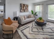 Thumbnail 1 of 38 - Living room with a couch and a coffee table at Arbor Heights, Tigard, Oregon