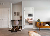 Thumbnail 2 of 35 - A room with a pink chair and a cowhide rug.
