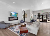 Thumbnail 42 of 50 - A living room with a flat screen TV mounted on the wall.