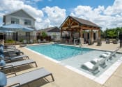Thumbnail 2 of 28 - our apartments have a resort style pool with lounge chairs