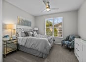 Thumbnail 3 of 21 - a bedroom with a bed and a window