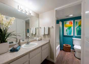 Thumbnail 25 of 56 - a bathroom with a sink and a toilet