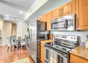 Thumbnail 30 of 33 - Kitchen cabinets at Stone Canyon Apartments, California,92507