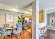 Thumbnail 29 of 33 - Kitchen with Dining Area at Stone Canyon Apartments, Riverside