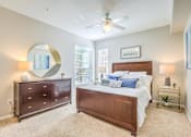 Thumbnail 31 of 33 - Bedroom with cozy bed at Stone Canyon Apartments, Riverside, California
