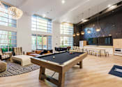 Thumbnail 15 of 28 - a large room with a pool table in the center of it