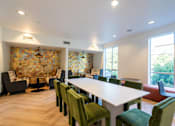 Thumbnail 17 of 28 - a conference room with a white table and chairs